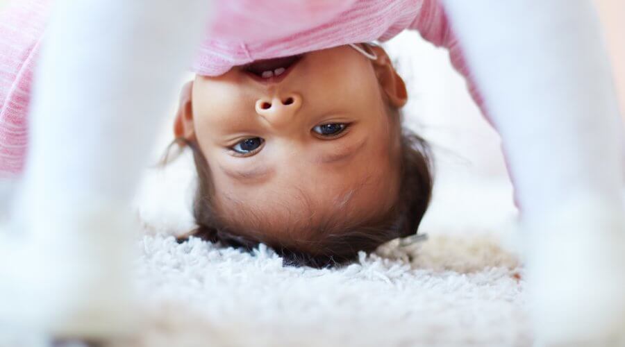 toddler looking upside down