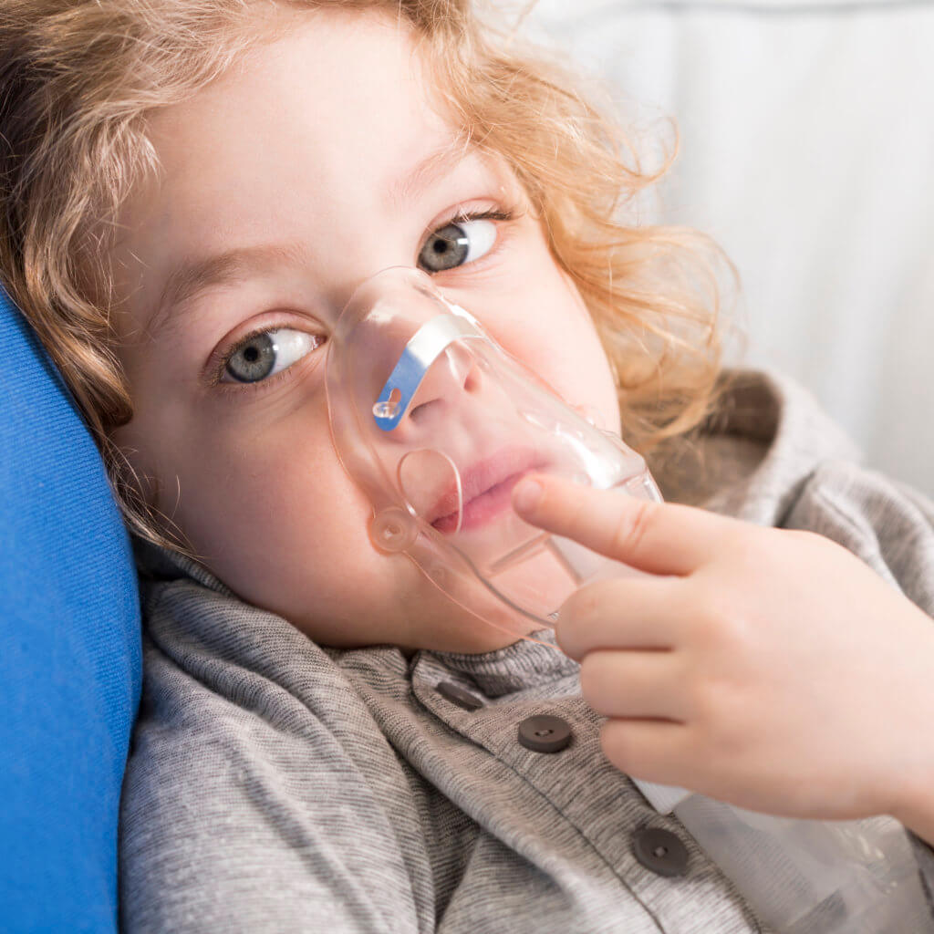 small child with nebulizer