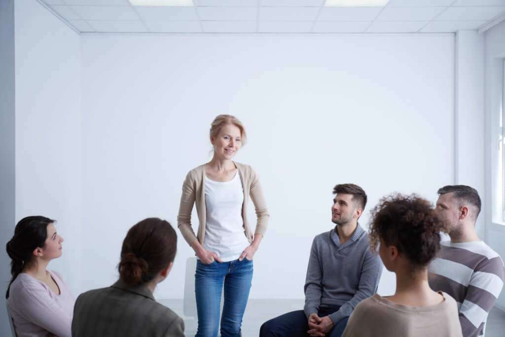 a woman standing up in a group