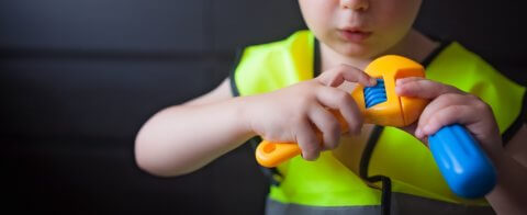 Boy playing as a foreman