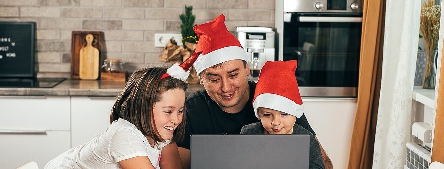 Dad and two children video chatting online