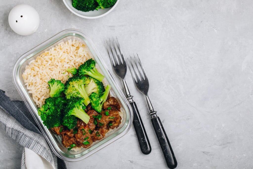 food in a glass container with silverware