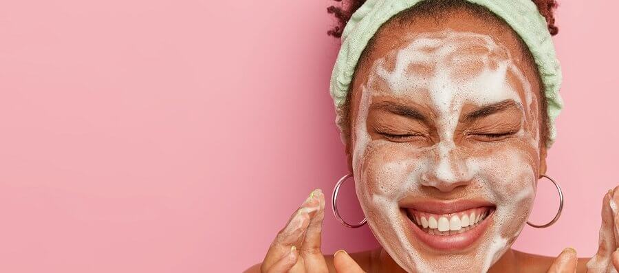 a young girl with a soapy face