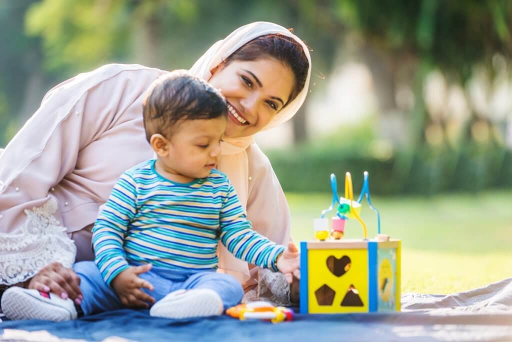 a mom playing with her toddler boy