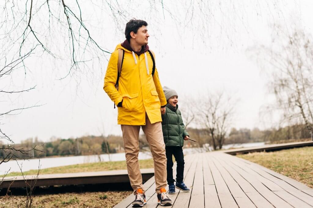 a man and his son walking outside