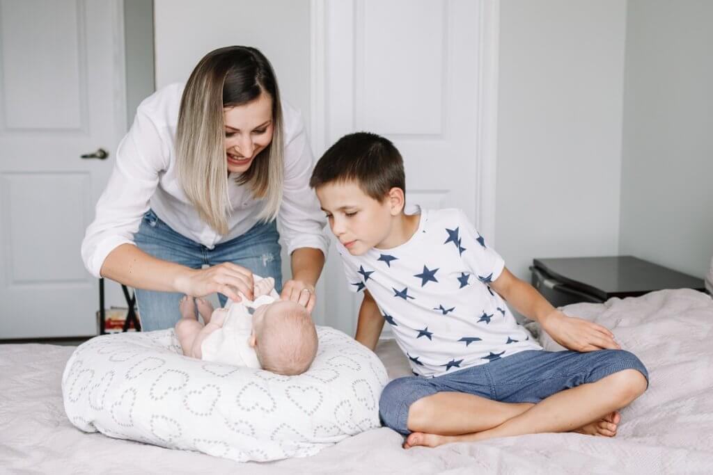 a mom with a baby and older sibling