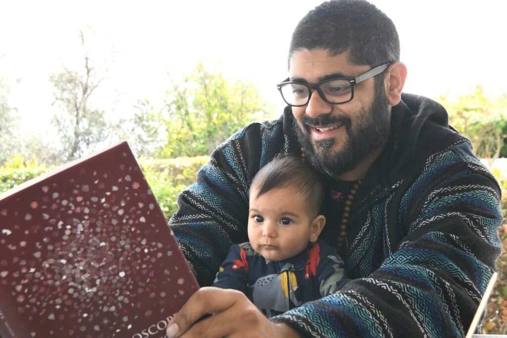 dad reading to baby