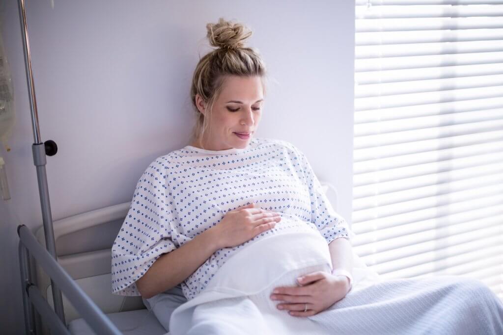 pregnant woman in hospital bed