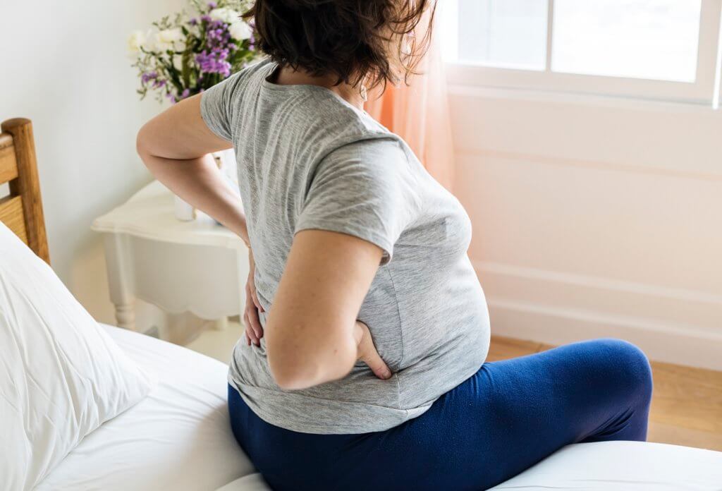 Back Pain in Pregnancy - Causes, Prevention & Relief